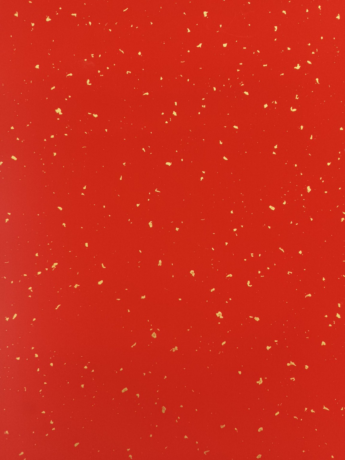 Close-up sample of QIYU gold-speckled ever-red rice paper